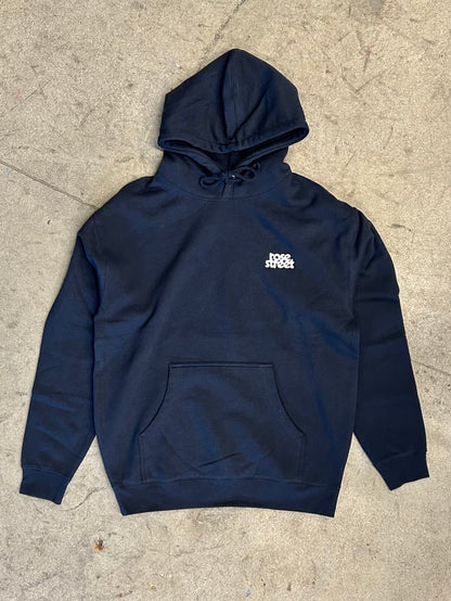 Navy blue hoodie with a logo on a concrete floor